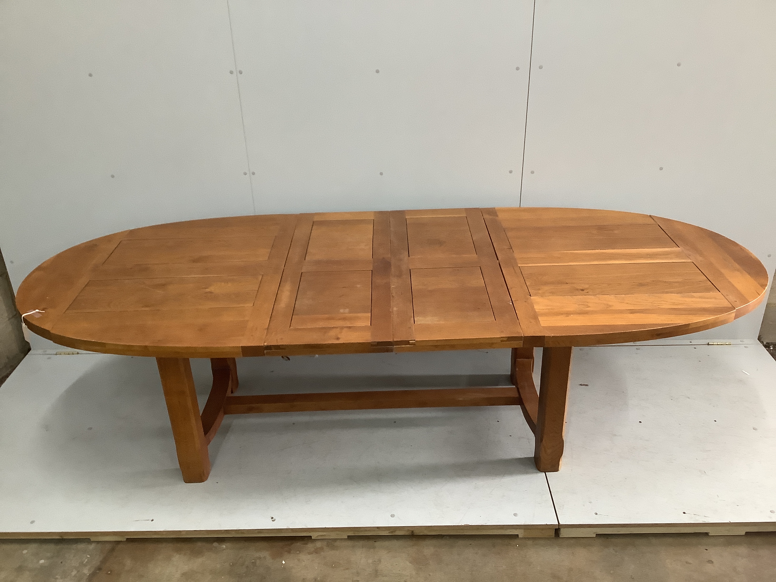 A contemporary oval oak extending dining table, 270cm extended, two spare leaves, depth 110cm, - Image 2 of 2