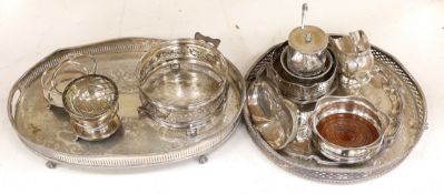 A quantity of silver plate including two trays with pierced galleries, a wine coaster, condiment