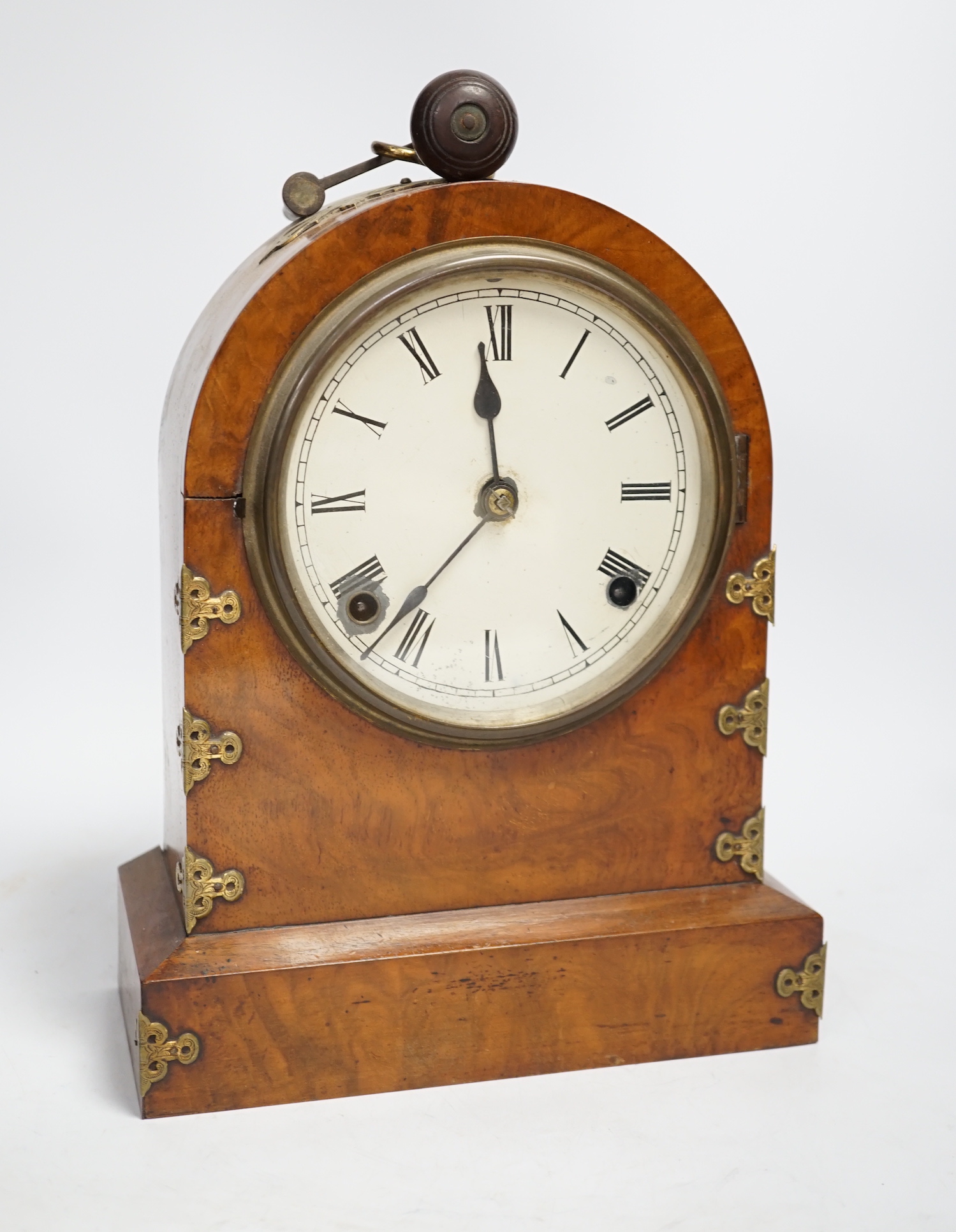 A Victorian walnut and brass mounted mantel clock, 26cm high