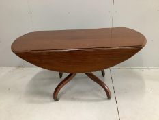 A Regency mahogany oval drop leaf dining table, width 140cm, depth 64cm, height 73cm