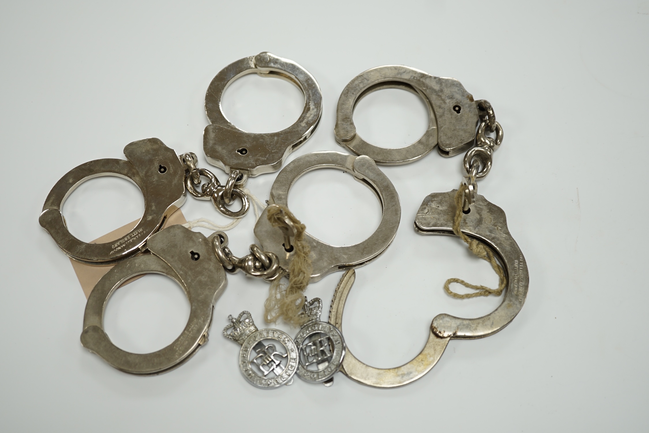 Three handcuffs, two with keys and two Metropolitan Police badges - Image 2 of 6