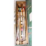 An early 20th century boxed croquet set