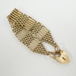 A 1960's 9ct gold gate link bracelet, with heart shaped padlock clasp, 17cm, 31.3 grams.