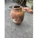 A terracotta amphora, height 54cm