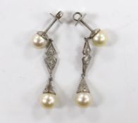 A pair of white metal, two stone cultured pearl and two stone diamond chip set drop earrings,