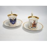 A pair of German porcelain armorial cups and saucers, one saucer reads ‘Lord Bingham s/m Y.