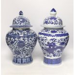 Two Chinese blue and white vases and covers, 38cm high