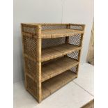 A wicker four tier shelving unit, width 121cm, depth 46cm, height 129cm