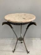 An Empire style circular cast metal, marble top occasional table with eagle head supports,