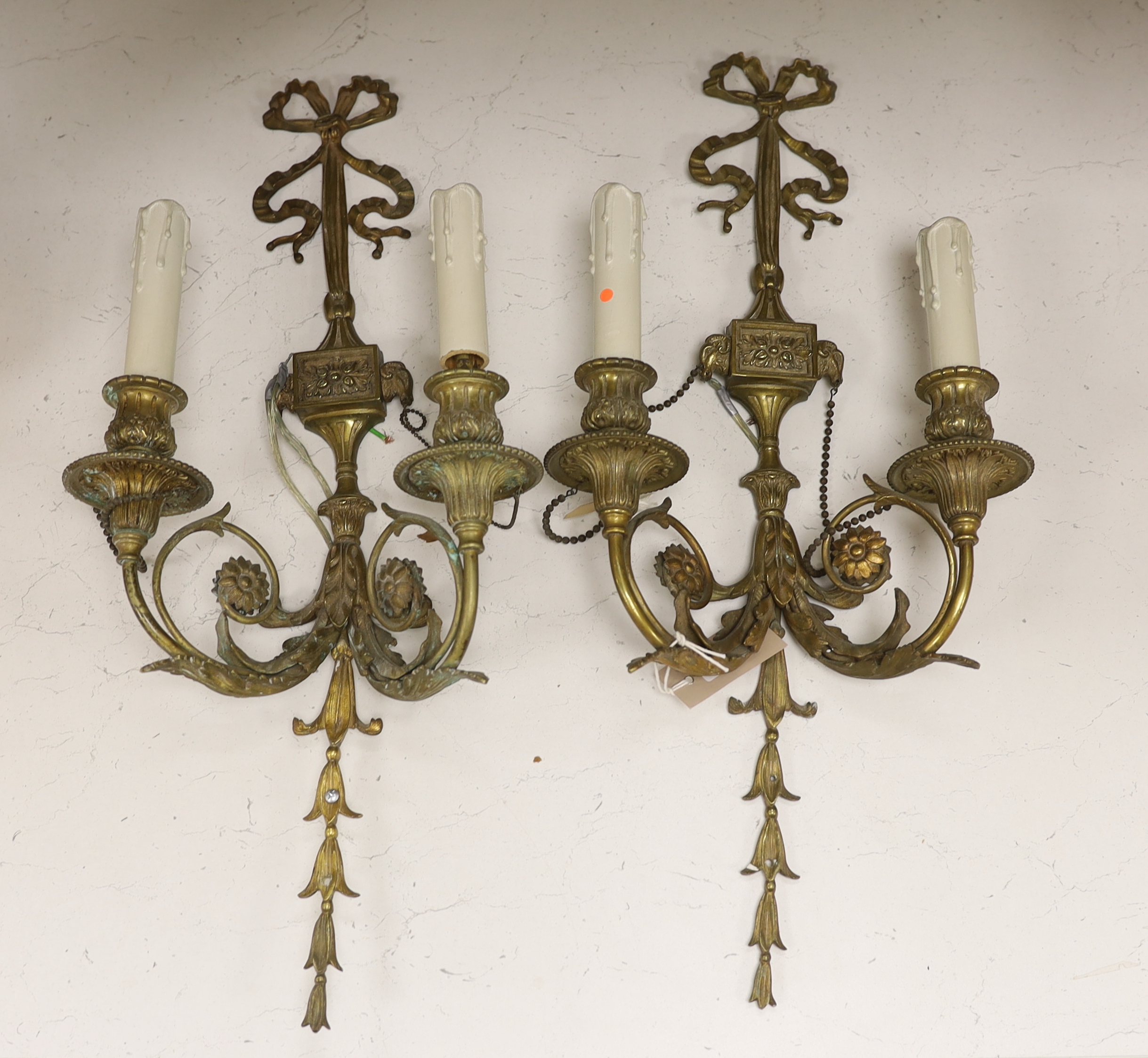 A pair of French Louis XVI style two branch ormolu wall lights, 60cm high