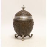 A unmarked white metal mounted coconut cup, on three scroll feet, height 17.4cm.