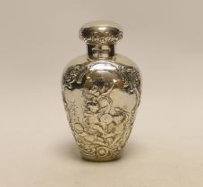 An Edwardian continental embossed silver tea caddy? and cover decorated with amorini, makers stamp