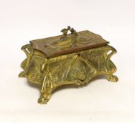 An Art Nouveau gilt metal jewellery casket with padded lining, 23cm wide