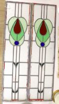 A pair of stained glass leaded panels, 98cm high x 25.5cm wide