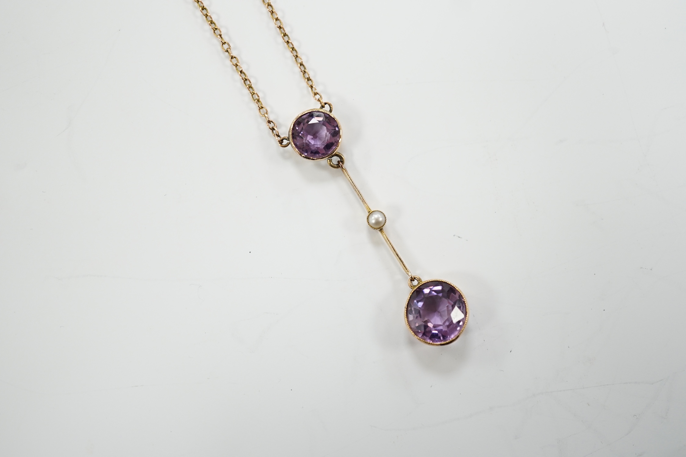 An Edwardian 9ct, two stone amethyst and single stone seed pearl set drop pendant necklace, gross - Image 5 of 9