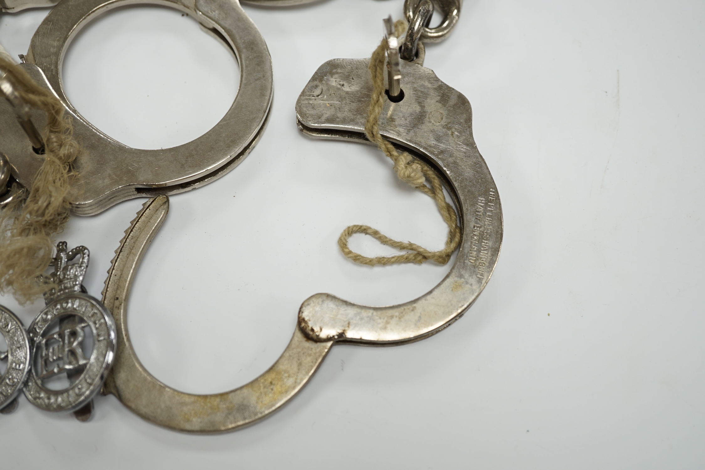 Three handcuffs, two with keys and two Metropolitan Police badges - Image 6 of 6