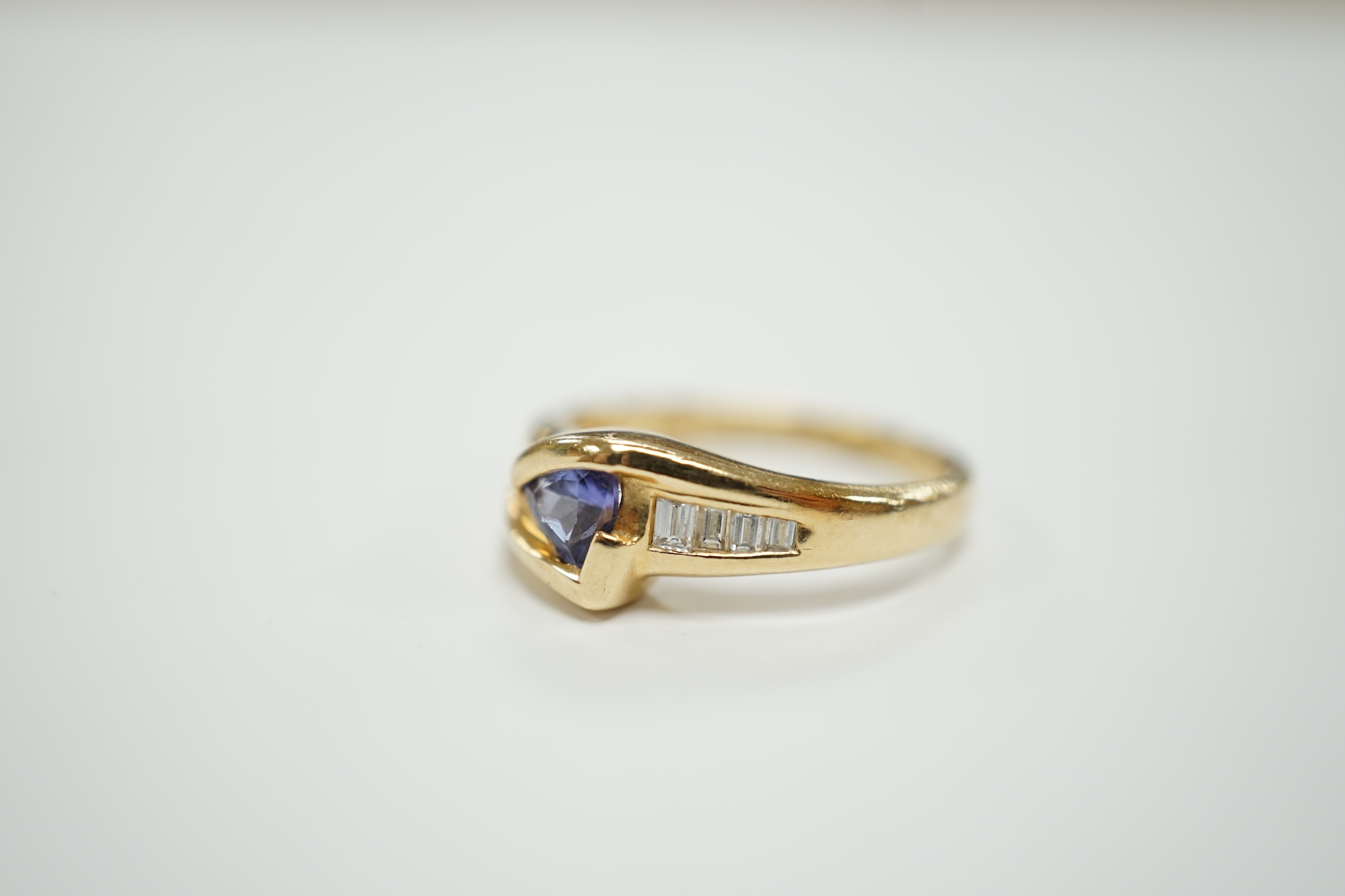 A modern 14ct and single stone tanzanite and graduated eight stone baguette cut diamond set ring, - Image 2 of 7