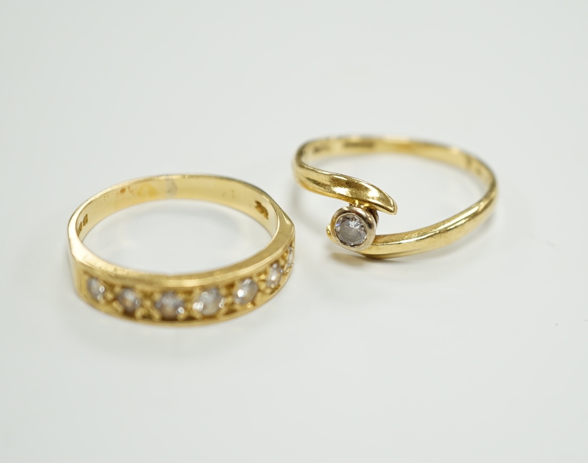 A modern 18ct gold and graduated seven stone diamond set half hoop ring, size O and a similar