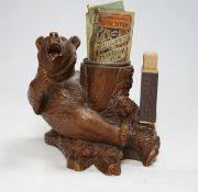 A carved Black Forest bear matchbox holder, 13cm high