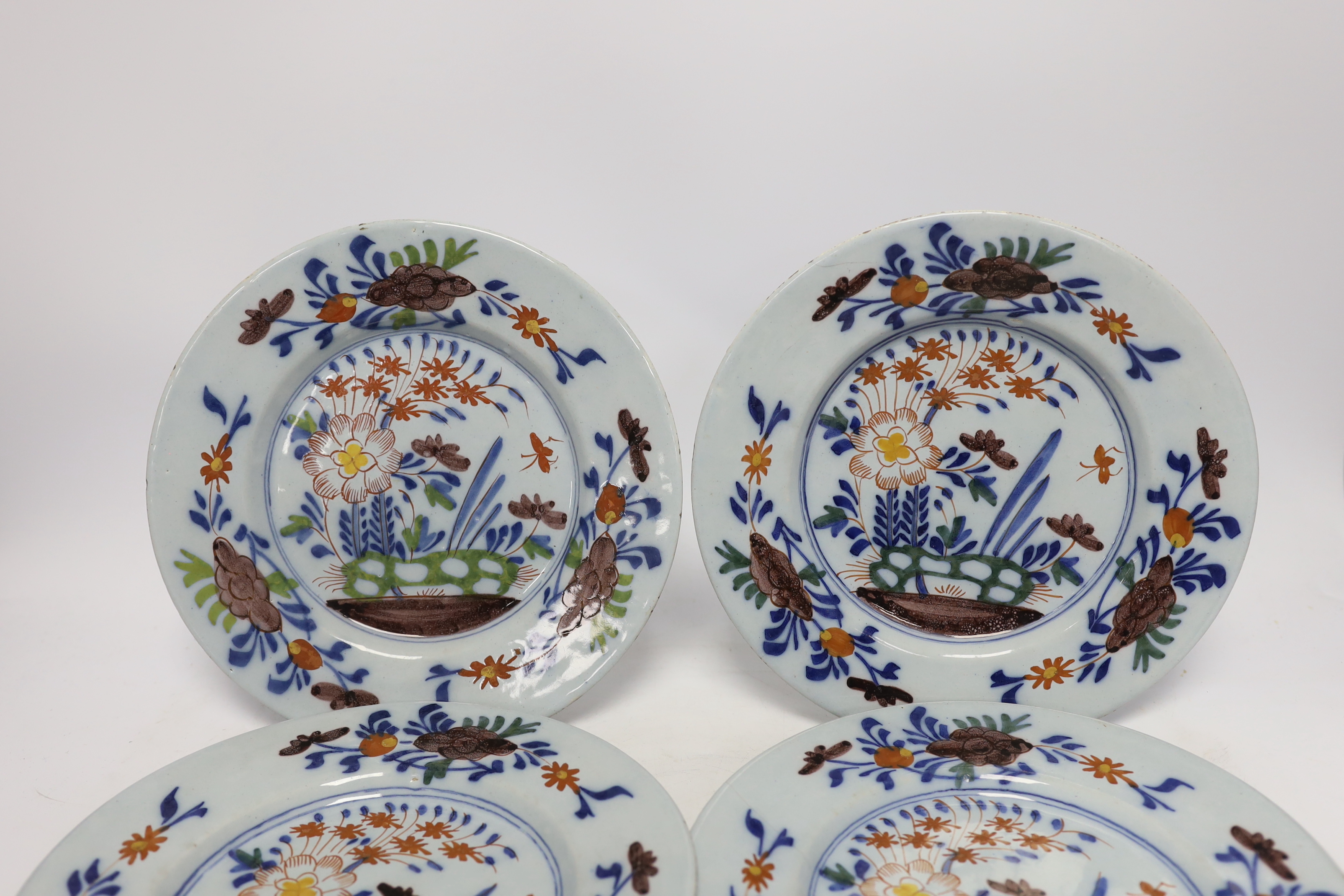 A set of four mid 18th century Delft polychrome floral plates, 22.5cm diameter - Image 2 of 4