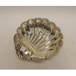 A George V pierced silver scallop shaped bowl, on fluted ball feet, Atkin Brothers, Sheffield, 1902,