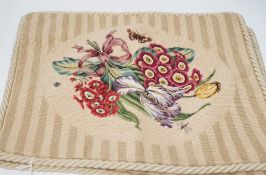 Four rectangular beige petite point floral cushion covers with corded edging