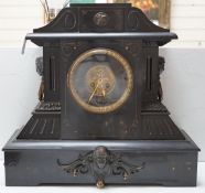 A large black slate mantel clock, with visible Brocot escapement, 45cm high