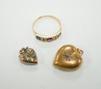 Two late Victorian 9ct and gem set heart pendants and an 18ct and gem set ring.