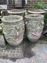 A pair of large reconstituted stone gardens urns with rope moulded bodies, diameter 44cm, height