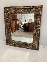 An Eastern rectangular carved hardwood wall mirror, width 71cm, height 81cm