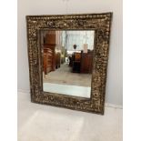 An Eastern rectangular carved hardwood wall mirror, width 71cm, height 81cm