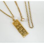 An 18ct gold ingot pendant on an 18k chain, 26.7 grams and two 9ct chains, one with cultured pearl