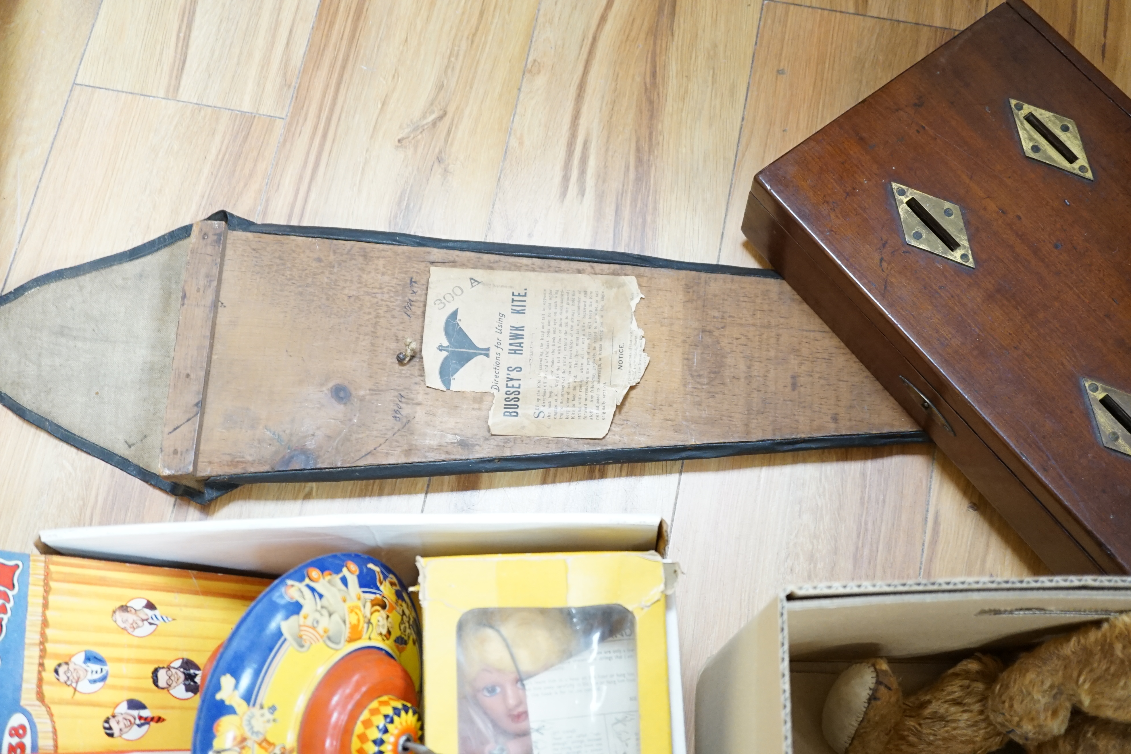 An early 20th century cased Bussey’s Hawk kite, a black walkie talkie doll, a four slot money box, - Image 3 of 8