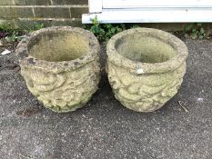 A pair of small circular reconstituted stone garden planters, diameter height