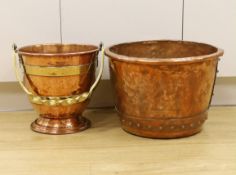 An Arts and Crafts copper and brass bucket, together with a copper embossed pot, both 30cm high