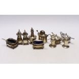 Ten assorted silver cruets, including mustards and pepperettes.