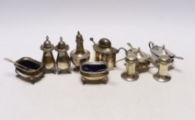 Ten assorted silver cruets, including mustards and pepperettes.