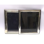 Two large modern silver mounted rectangular photograph frames, 32.9cm and 32cm.