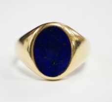 A George V 18ct gold and oval lapis lazuli set signet ring, hallmarked for Chester, 1915, size U,