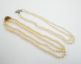 A single strand cultured pearl necklace, with turquoise? and seed pearl set 9ct clasp, 56cm and a