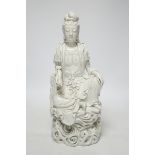 A late 19th / early 20th century Chinese blanc de Chine seated figure of Guanyin, impressed mark