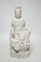 A late 19th / early 20th century Chinese blanc de Chine seated figure of Guanyin, impressed mark