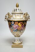 A late 20th century ‘rams head’ porcelain urn and cover, 38cm