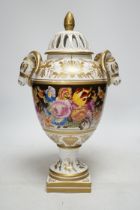 A late 20th century ‘rams head’ porcelain urn and cover, 38cm