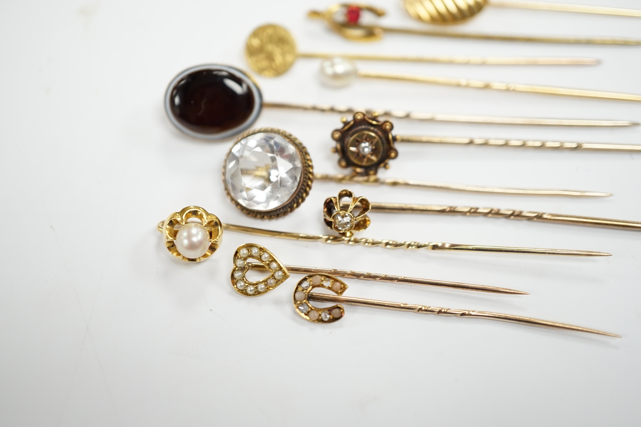 Fifteen assorted mainly early 20th century yellow metal and gem set stick pins, including diamond, - Image 7 of 11