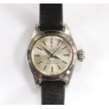 A lady's stainless steel Tudor Oyster Royal manual wind wrist watch, on an associated black