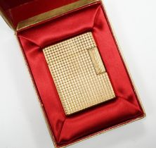 A cased gold plated Dupont lighter with booklet