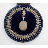 A Victorian silver octagonal locket with engraved aesthetic decoration, Birmingham, 1881, 43mm, on a