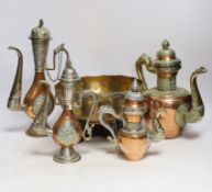 Four Tibetan overlaid copper teapots and an engraved brass bowl, tallest 34cm