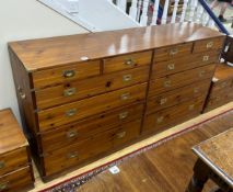 A large military style brass mounted pine twelve drawer chest, width 183cm, depth 46cm, height 97cm